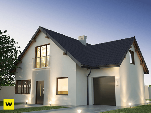 Modernes Einfamilienhaus mit Satteldach, Garage und beleuchteter Einfahrt bei Abenddämmerung.